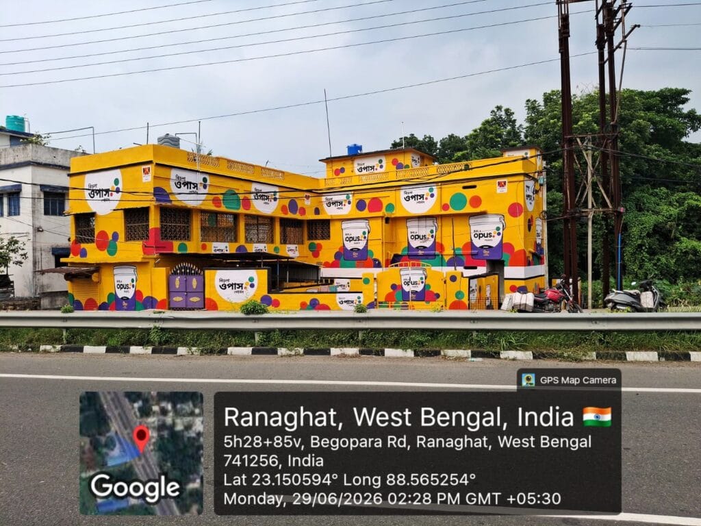 Highway-facing commercial building advertisement on NH12 in Ranaghat, West Bengal