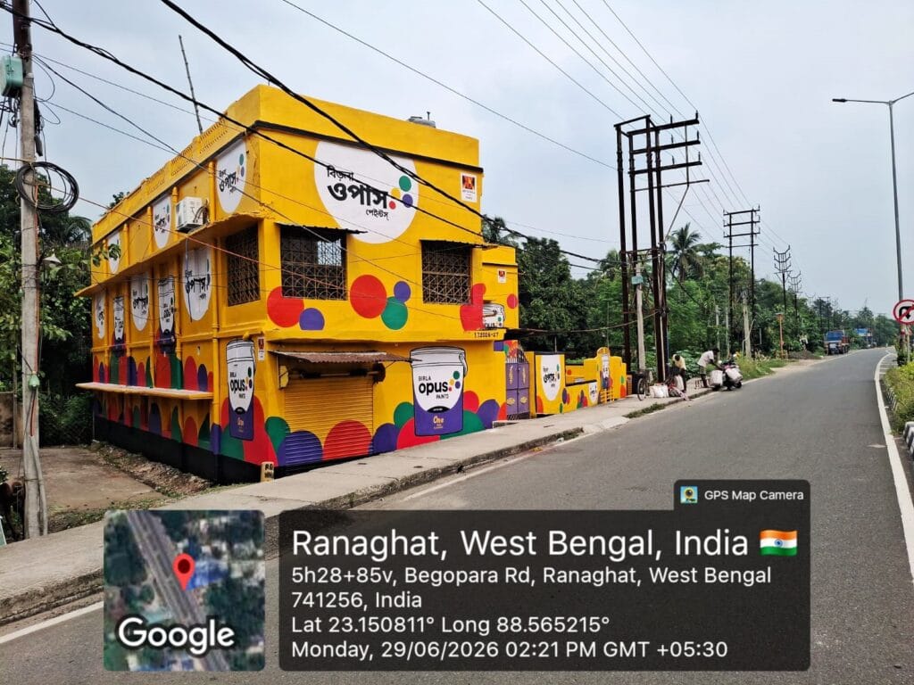 Premium Birla Opus outdoor building advertisement with vibrant wall painting by Advators